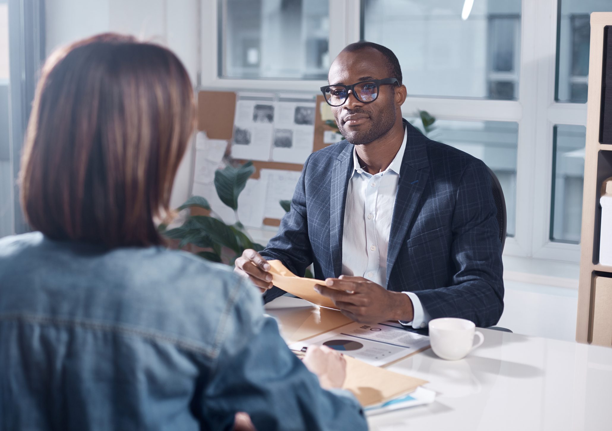 Businessman discussing documents during a meeting.